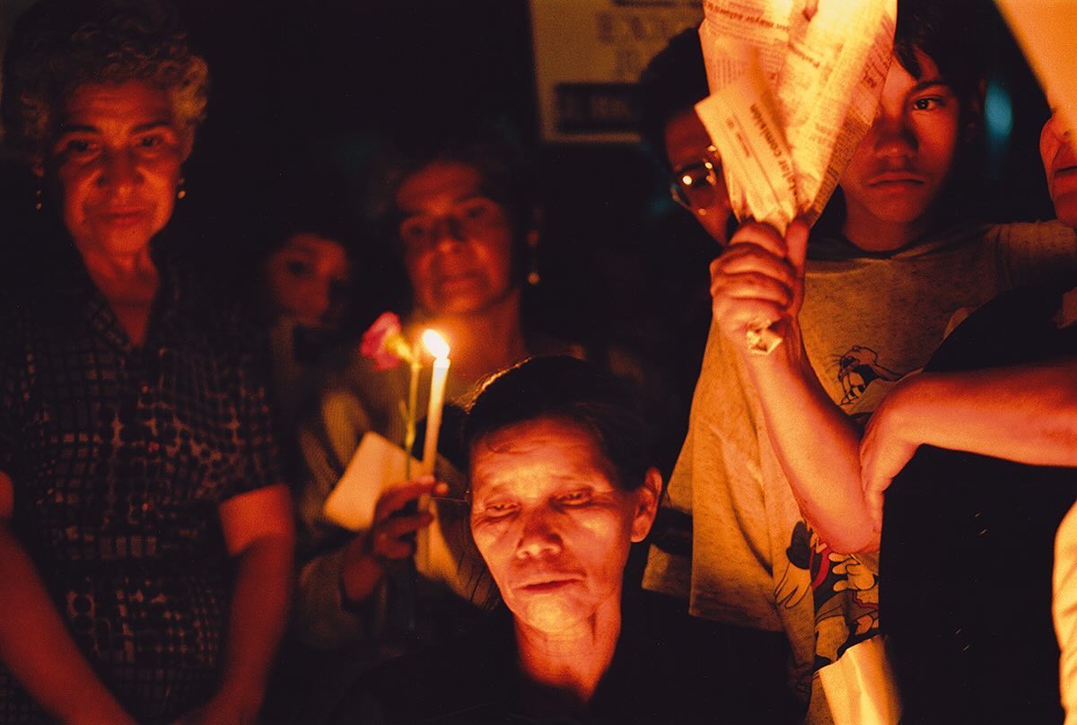 People light candles outside the San Sebastian Church the day after of the assassination of Bishop Juan Jose Gerardi