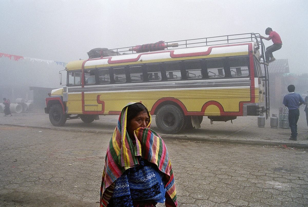 Guatemalan aboriginal woman waiting for a bus in Rabinal